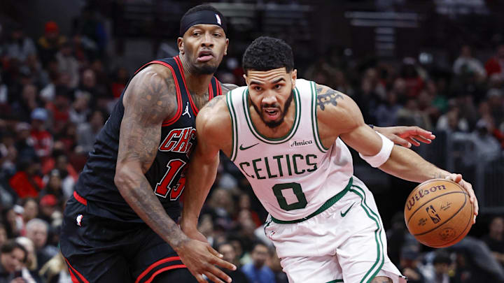 Nov 29, 2024; Chicago, Illinois, USA; Boston Celtics forward Jayson Tatum (0) drives to the basket against Chicago Bulls forward Torrey Craig (13) during the second half at United Center. Mandatory Credit: Kamil Krzaczynski-Imagn Images
