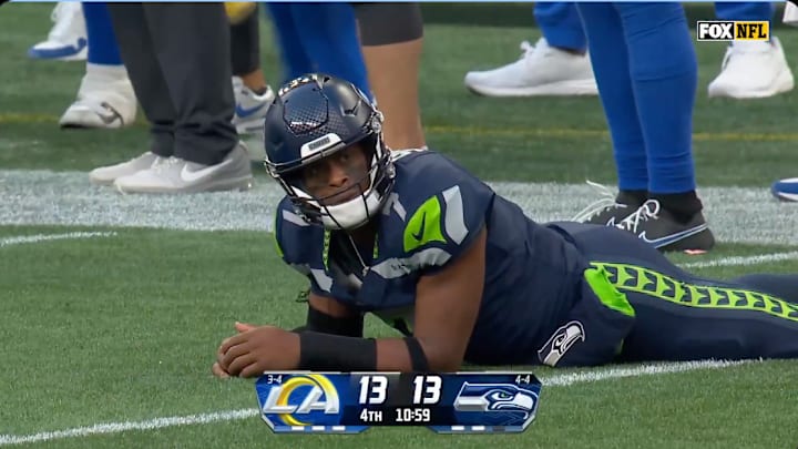 Geno Smith reacts after throwing an interception to Los Angeles Rams DB Kamren Kinchens.