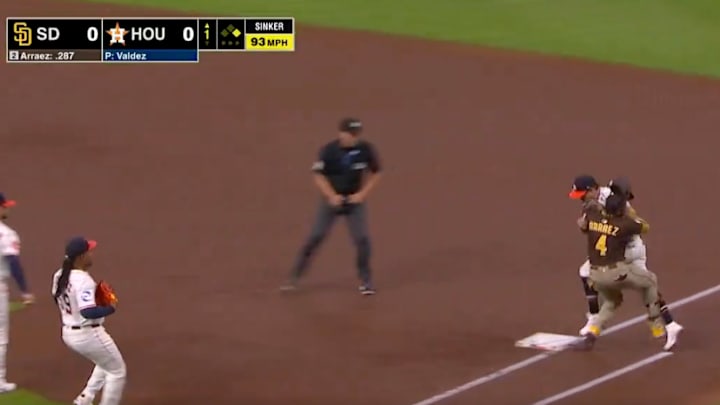 Luis Arraez collides with Mauricio Dubon while trying to run out an infield hit. 