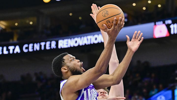 Oct 16, 2025; Salt Lake City, Utah, USA; Utah Jazz guard Elijah Harkless (16) makes layup against Portland Trail Blazers center Donovan Clingan (23) during the second half at Delta Center. Mandatory Credit: Peter Creveling-Imagn Images
