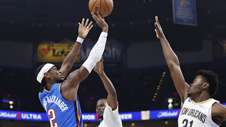 Nov 13, 2024; Oklahoma City, Oklahoma, USA; Oklahoma City Thunder guard Shai Gilgeous-Alexander (2) shoots as New Orleans Pelicans center Yves Missi (21) defends during the second quarter at Paycom Center. Mandatory Credit: Alonzo Adams-Imagn Images Nov 13, 2024; Oklahoma City, Oklahoma, USA; Oklahoma City Thunder guard Shai Gilgeous-Alexander (2) shoots as New Orleans Pelicans center Yves Missi (21) defends during the second quarter at Paycom Center. Mandatory Credit: Alonzo Adams-Imagn Images