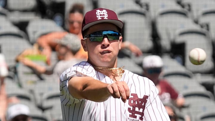 May 21, 2025; Hoover, AL, USA; Mississippi State third baseman Ace Reese (3) fields a bunt by Texas A&M second baseman Ben Royo (10) but makes a wild throw to first in the first round of the SEC Baseball Tournament at the Hoover Met.