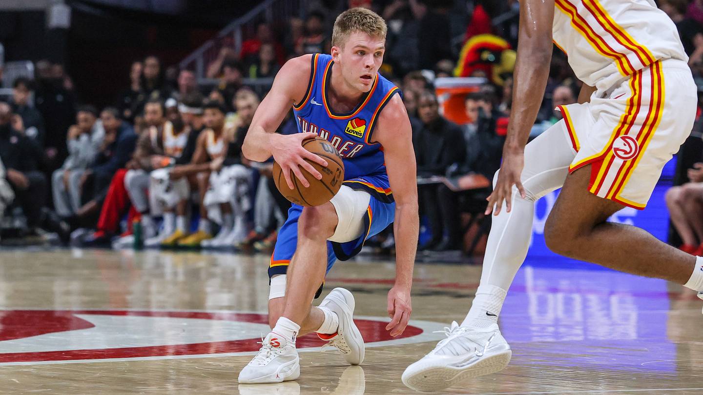 Oct 12, 2026; Atlanta, Georgia, USA; Oklahoma City Thunder guard Bennett Stirtz (14) dribbles against Atlanta Hawks forward