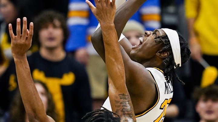 Nov 14, 2024; Columbia, Missouri, USA; Missouri Tigers forward Mark Mitchell (25) shoots the ball against Mississippi Valley State Delta Devils forward Walter Hamilton (5) during the first half at Mizzou Arena. Mandatory Credit: Jay Biggerstaff-Imagn Images