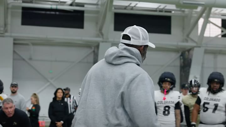 Sanders speaks to the Buffaloes after practice. Sanders speaks to the Buffaloes after practice.