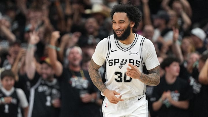 Apr 28, 2026; San Antonio, Texas, USA; San Antonio Spurs forward Julian Champagnie (30) reacts after scoring a 3-point basket during the second half of Game 5 of the first round of the 2026 NBA Playoffs against the Portland Trail Blazers at Frost Bank Center.