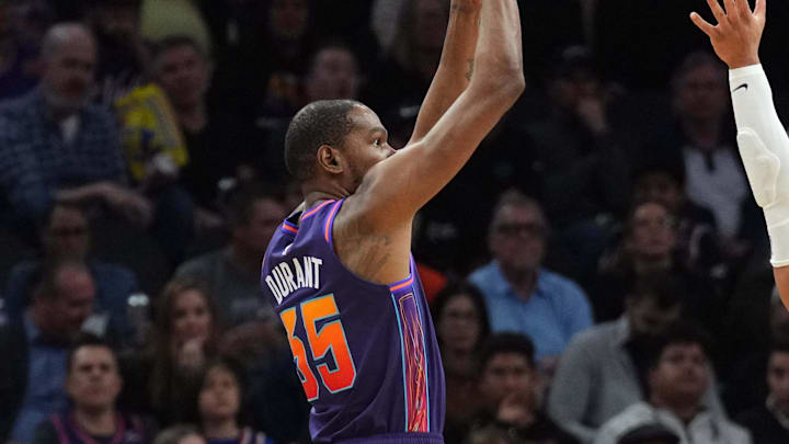 Feb 29, 2024; Phoenix, Arizona, USA; Phoenix Suns forward Kevin Durant (35) shoots over Houston Rockets forward Dillon Brooks (9) during the first half at Footprint Center. Mandatory Credit: Joe Camporeale-Imagn Images