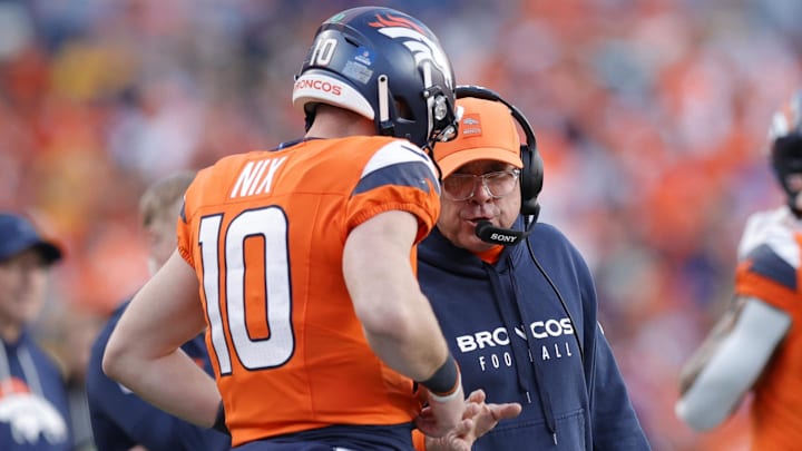 Dec 14, 2025; Denver, Colorado, USA; Denver Broncos head coach Sean Payton talks with quarterback Bo Nix (10) during the second quarter against the Green Bay Packers at Empower Field at Mile High. 