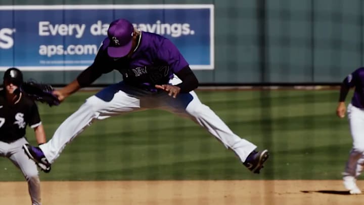 Colorado Rockies relief pitcher Jefry Yan celebrates a strikeout in spring training. 