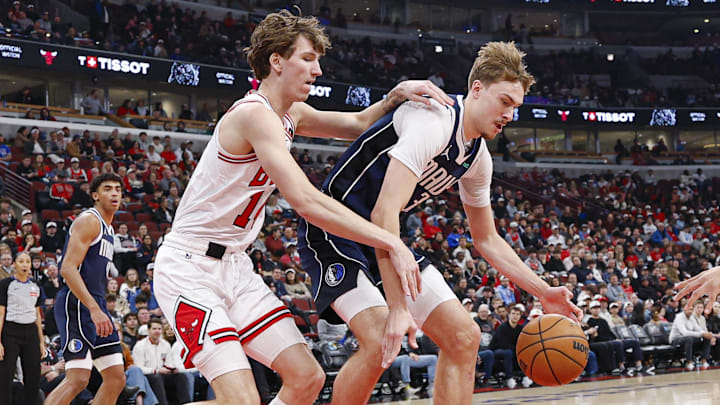 Jan 10, 2026; Chicago, Illinois, USA; Dallas Mavericks forward Cooper Flagg (32) defends against Chicago Bulls forward Matas Buzelis (14) during the first half at United Center. Mandatory Credit: Kamil Krzaczynski-Imagn Images
