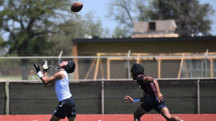 A Hale Center player catches a pass against Tulia in the Sudan 7-on-7 football state-qualifying tournament Friday, June 13, 2025, at Hornet Field in Sudan. A Hale Center player catches a pass against Tulia in the Sudan 7-on-7 football state-qualifying tournament Friday, June 13, 2025, at Hornet Field in Sudan.