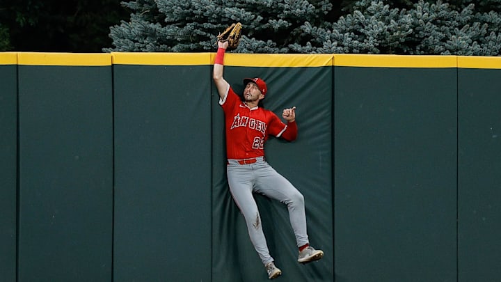 Sep 19, 2025; Denver, Colorado, USA; Los Angeles Angels center fielder Bryce Teodosio (22) makes a catch at the wall in the third inning against the Colorado Rockies at Coors Field. Mandatory Credit: Isaiah J. Downing-Imagn Images