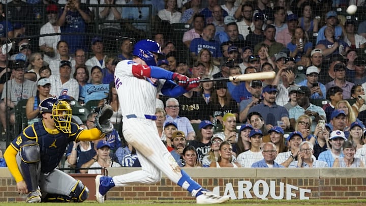 Jun 17, 2025; Chicago, Illinois, USA; Chicago Cubs outfielder Pete Crow-Armstrong (4) hits a home run against the Milwaukee Brewers during the eighth inning at Wrigley Field.