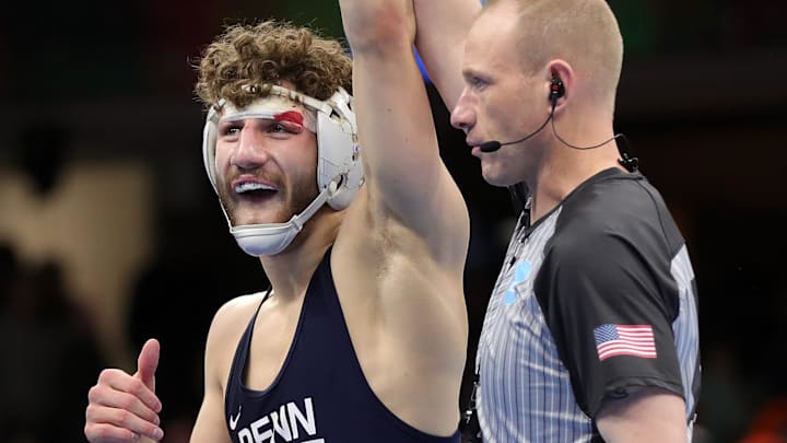 Penn State’s Mitchell Mesenbrink celebrates after beating Iowa’s Mikey Caliendo in the 165 pound finals match in the NCAA Division I wrestling championships at Rocket Arena, March 21, 2026, in Cleveland, Ohio. Penn State’s Mitchell Mesenbrink celebrates after beating Iowa’s Mikey Caliendo in the 165 pound finals match in the NCAA Division I wrestling championships at Rocket Arena, March 21, 2026, in Cleveland, Ohio.