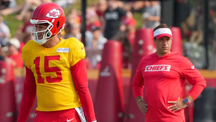 Jul 26, 2024; Kansas City, MO, USA; Kansas City Chiefs quarterback Patrick Mahomes (15) steps to the line as general manager Brett Veach watches in the background during training camp at Missouri Western State University. Mandatory Credit: Denny Medley-Imagn Images Jul 26, 2024; Kansas City, MO, USA; Kansas City Chiefs quarterback Patrick Mahomes (15) steps to the line as general manager Brett Veach watches in the background during training camp at Missouri Western State University. Mandatory Credit: Denny Medley-Imagn Images