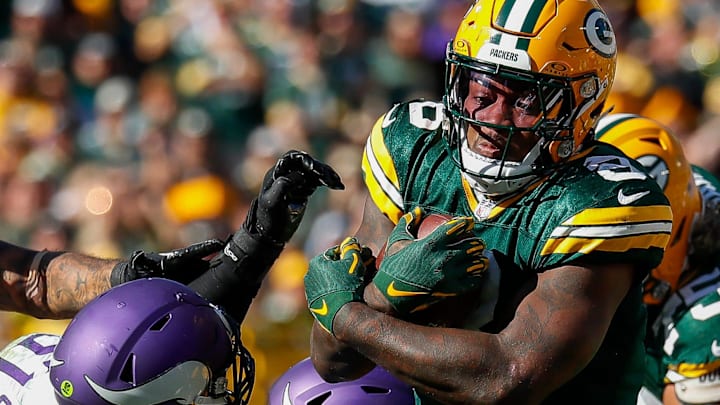 Green Bay Packers running back Josh Jacobs (8) runs the ball against the Minnesota Vikings last season at Lambeau Field.