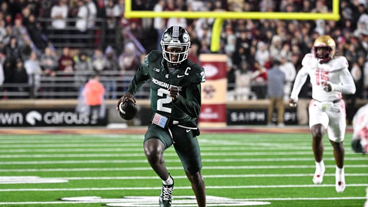 Sep 21, 2024; Chestnut Hill, Massachusetts, USA; Michigan State Spartans quarterback Aidan Chiles (2) runs the ball against the Boston College Eagles during the first half at Alumni Stadium. Mandatory Credit: Eric Canha-Imagn Images