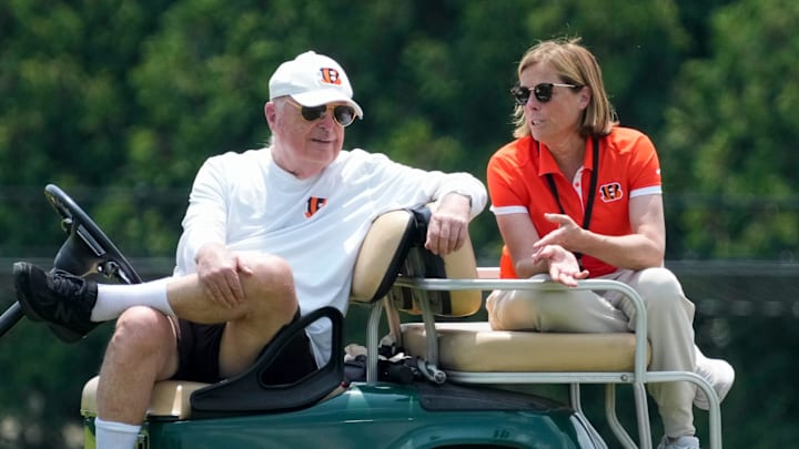 Cincinnati Bengals executives Mike Brown and his daughter Katie Blackburn talk on the sideline during a session of organized team activities on the Bengals practice field at Paycor Stadium in downtown Cincinnati on Tuesday, June 3, 2025.