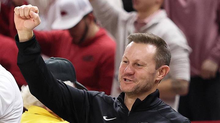 Arkansas Razorbacks coach Ryan Silverfield “Calls the Hogs” during the second half against the James Madison Dukes at Bud Walton Arena. Arkansas won 103-74. 