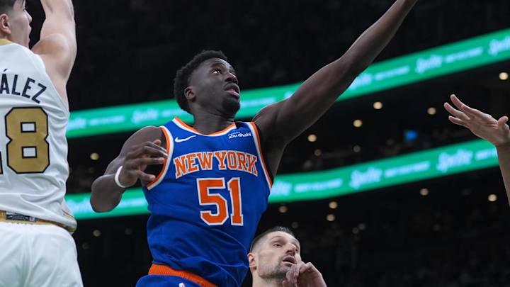 Feb 8, 2026; Boston, Massachusetts, USA; New York Knicks forward Mohamed Diawara (51) drive the ball to the basket against Boston Celtics guard Hugo Gonzalez (28) in the first quarter at TD Garden. Mandatory Credit: David Butler II-Imagn Images