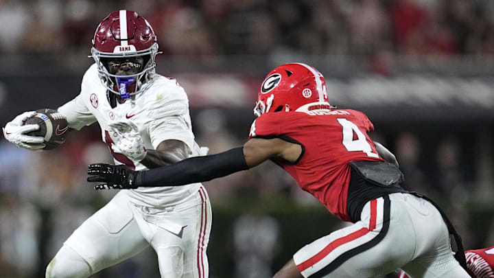 Sep 27, 2025; Athens, Georgia, USA; Alabama Crimson Tide wide receiver Germie Bernard (5) runs against Georgia Bulldogs defensive back Ellis Robinson IV (1) and defensive back KJ Bolden (4) in the second half at Sanford Stadium. Mandatory Credit: Dale Zanine-Imagn Images