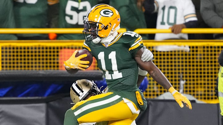 Dec 23, 2024; Green Bay, Wisconsin, USA; Green Bay Packers wide receiver Jayden Reed (11) is tackled by New Orleans Saints safety Ugo Amadi (0) after catching a pass during the fourth quarter at Lambeau Field. Mandatory Credit: Jeff Hanisch-Imagn Images Dec 23, 2024; Green Bay, Wisconsin, USA; Green Bay Packers wide receiver Jayden Reed (11) is tackled by New Orleans Saints safety Ugo Amadi (0) after catching a pass during the fourth quarter at Lambeau Field. Mandatory Credit: Jeff Hanisch-Imagn Images