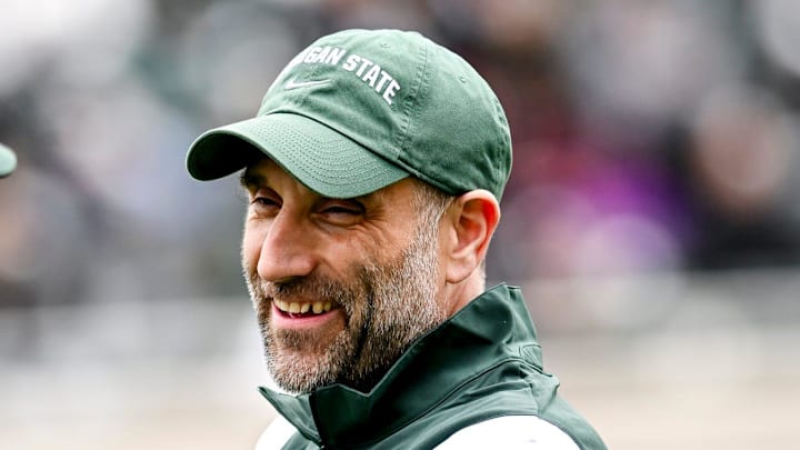 Michigan State defensive coordinator Joe Rossi, right, talks with offensive coordinator Brian Lindgren during the Spring Showcase on Saturday, April 20, 2024, at Spartan Stadium in East Lansing.