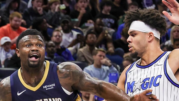 New Orleans Pelicans forward Zion Williamson drives to the basket against Orlando Magic forward Noah Penda.
