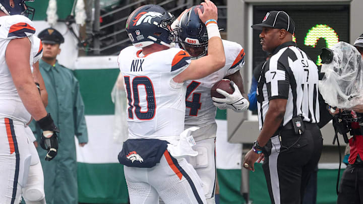 Sep 29, 2024; East Rutherford, New Jersey, USA; Denver Broncos wide receiver Courtland Sutton (14) celebrates a touchdown reception with quarterback Bo Nix (10) during the second half against the New York Jets at MetLife Stadium.