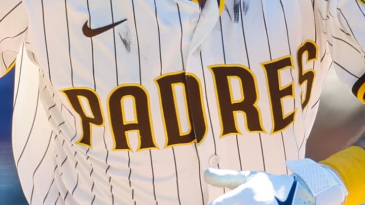 San Diego Padres center fielder Jackson Merrill (3) hits a sacrifice fly during the eighth inning against the New York Mets at Petco Park on July 30. 