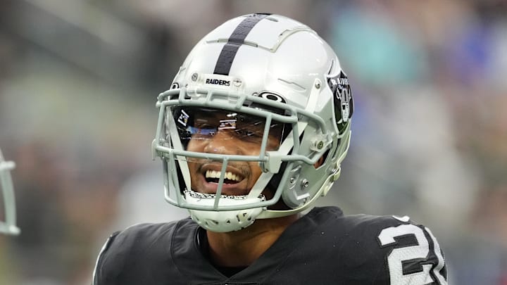 Nov 13, 2022; Paradise, Nevada, USA; Las Vegas Raiders safety Isaiah Pola-Mao (20) talks with Indianapolis Colts cornerback Tony Brown (38) during the first half at Allegiant Stadium. Mandatory Credit: Stephen R. Sylvanie-Imagn Images