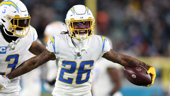 Jan 14, 2023; Jacksonville, Florida, USA; Los Angeles Chargers cornerback Asante Samuel Jr. (26) celebrates with safety Derwin James Jr. (3) after an interception during the second quarter of a wild card game against the Jacksonville Jaguars at TIAA Bank Field. Mandatory Credit: Nathan Ray Seebeck-Imagn Images Jan 14, 2023; Jacksonville, Florida, USA; Los Angeles Chargers cornerback Asante Samuel Jr. (26) celebrates with safety Derwin James Jr. (3) after an interception during the second quarter of a wild card game against the Jacksonville Jaguars at TIAA Bank Field. Mandatory Credit: Nathan Ray Seebeck-Imagn Images