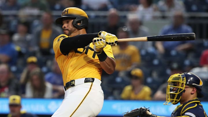 Sep 5, 2025; Pittsburgh, Pennsylvania, USA;  Pittsburgh Pirates left fielder Tommy Pham (28) hits a RBI double against the Milwaukee Brewers during the third inning at PNC Park. Mandatory Credit: Charles LeClaire-Imagn Images