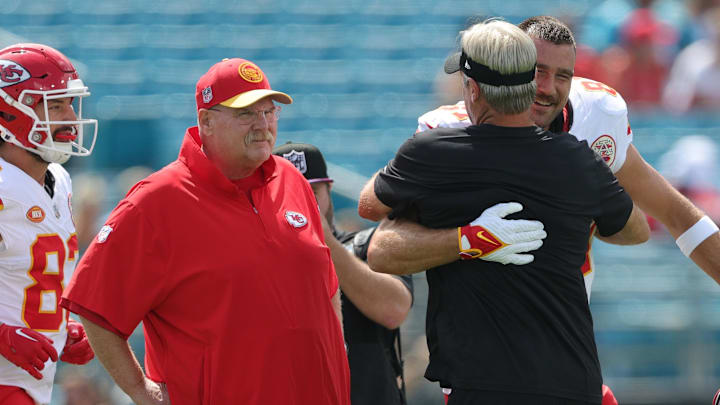 Sep 17, 2023; Jacksonville, Florida, USA;  Kansas City Chiefs head coach Andy Reid tight end Travis Kelce (87)and Jacksonville Jaguars head coach Doug Pederson talk before a game at EverBank Stadium. Mandatory Credit: Nathan Ray Seebeck-Imagn Images