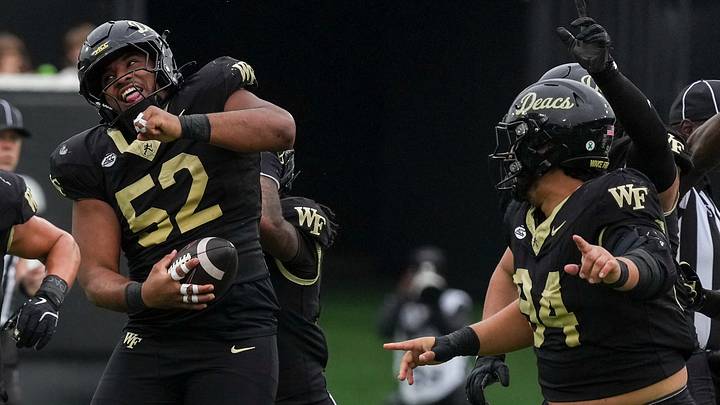 Wake Forest Demon Deacons defensive lineman Dallas Afalava (52) celebrates his interception Mandatory Credit: Jim Dedmon-Imagn Images Wake Forest Demon Deacons defensive lineman Dallas Afalava (52) celebrates his interception Mandatory Credit: Jim Dedmon-Imagn Images