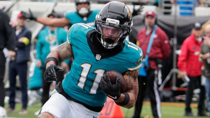 Jan 4, 2026; Jacksonville, Florida, USA; Jacksonville Jaguars wide receiver Parker Washington (11) catches a twenty-three yard pass for a touchdown thrown by quarterback Trevor Lawrence (not pictured) against against the Tennessee Titans during the first quarter at EverBank Stadium. Mandatory Credit: Travis Register-Imagn Images