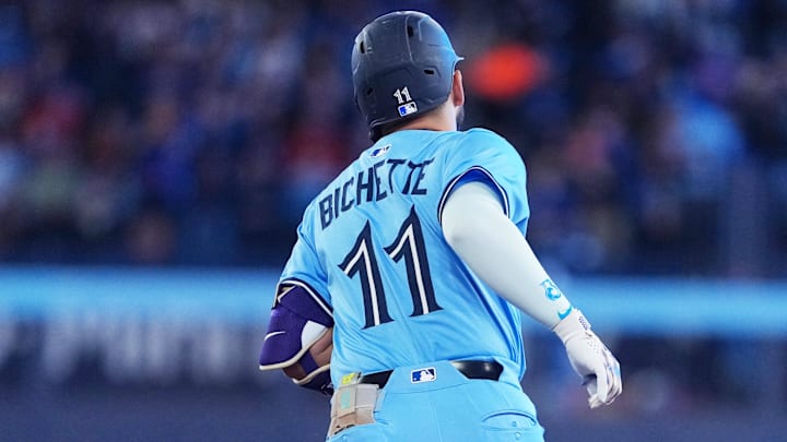 May 31, 2025; Toronto, Ontario, CAN; Toronto Blue Jays shortstop Bo Bichette (11) runs the bases after hitting his 100th career home run against the Athletics during the second inning at Rogers Centre