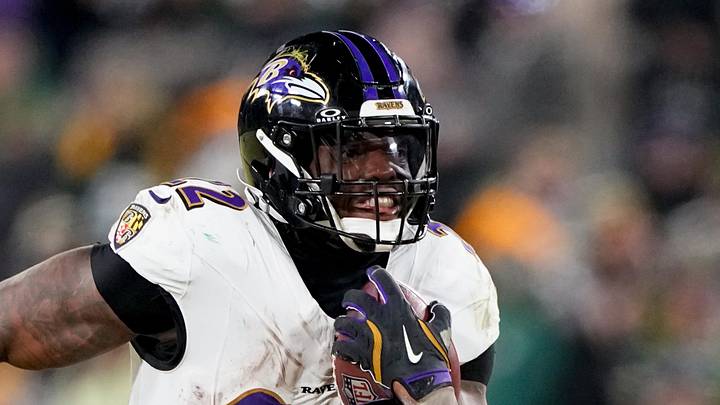 Dec 27, 2025; Green Bay, Wisconsin, USA; Baltimore Ravens running back Derrick Henry (22) runs for a touchdown during the fourth quarter against the Green Bay Packers at Lambeau Field. Mandatory Credit: Jeff Hanisch-Imagn Images