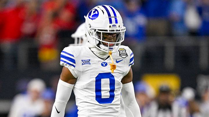 Dec 6, 2025; Arlington, TX, USA; BYU Cougars cornerback Evan Johnson (0) celebrates during the game between the Red Raiders and the Cougars at AT&T Stadium. Mandatory Credit: Jerome Miron-Imagn Images