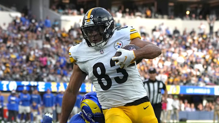 Oct 22, 2023; Inglewood, California, USA; Pittsburgh Steelers tight end Connor Heyward (83) carries the ball against the Los Angeles Rams in the second half at SoFi Stadium. Mandatory Credit: Kirby Lee-Imagn Images