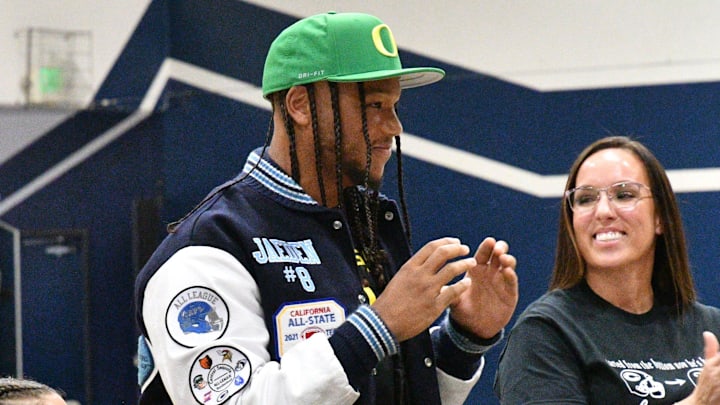 Central Valley Christian senior Jaeden Moore, center, verbally committed on Aug. 17, 2022 to play college football at the University of Oregon. Central Valley Christian senior Jaeden Moore, center, verbally committed on Aug. 17, 2022 to play college football at the University of Oregon.