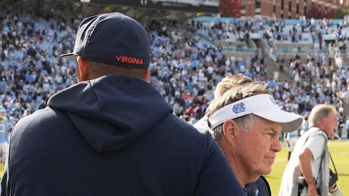 Oct 25, 2025; Chapel Hill, North Carolina, USA; North Carolina Tar Heels head coach Bill Belichick shakes Virginia Cavaliers head coach Tony Elliott hand after the Tar Heels lose to Virginia in overtime at Kenan Stadium. Mandatory Credit: Bob Donnan-Imagn Images