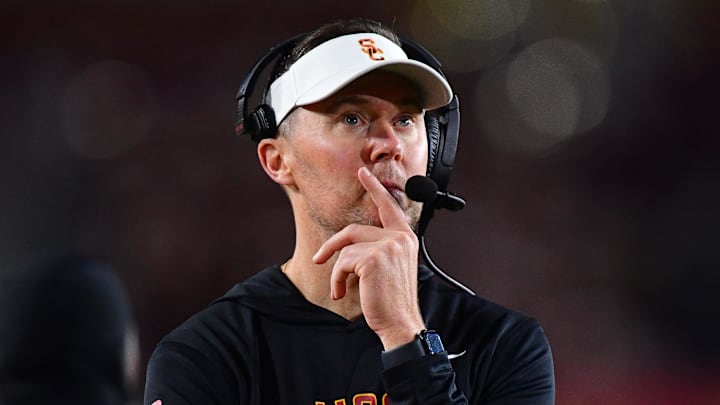 Nov 7, 2025; Los Angeles, California, USA; Southern California Trojans head coach Lincoln Riley watches game action against the Northwestern Wildcats during the second half at the Los Angeles Memorial Coliseum. Mandatory Credit: Gary A. Vasquez-Imagn Images Nov 7, 2025; Los Angeles, California, USA; Southern California Trojans head coach Lincoln Riley watches game action against the Northwestern Wildcats during the second half at the Los Angeles Memorial Coliseum. Mandatory Credit: Gary A. Vasquez-Imagn Images