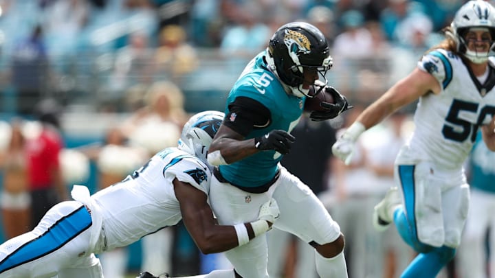 Sep 7, 2025; Jacksonville, Florida, USA; Jacksonville Jaguars wide receiver Dyami Brown (5) is tackled by Carolina Panthers cornerback Mike Jackson (2) during the first half at EverBank Stadium. Mandatory Credit: Morgan Tencza-Imagn Images Sep 7, 2025; Jacksonville, Florida, USA; Jacksonville Jaguars wide receiver Dyami Brown (5) is tackled by Carolina Panthers cornerback Mike Jackson (2) during the first half at EverBank Stadium. Mandatory Credit: Morgan Tencza-Imagn Images