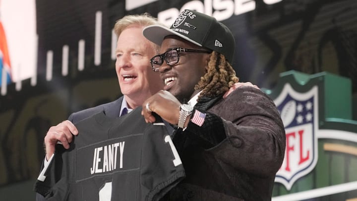 NFL Commissioner Rodger Goodell, left, with Boise State Broncos running back Ashton Jeanty is selected by the Las Vegas Raiders as the number six pick in the first round of the 2025 NFL Draft at Lambeau Field. Mark Hoffman / Milwaukee Journal Sentinel