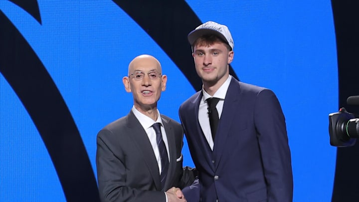 Jun 25, 2025; Brooklyn, NY, USA;  Cooper Flagg poses with NBA commissioner Adam Silver after being selected as first overall by the Dallas Mavericks in the first round of the 2025 NBA Draft at Barclays Center. Mandatory Credit: Brad Penner-Imagn Images