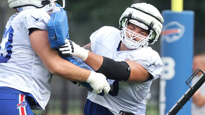 Offensive lineman Alec Anderson fights off a block during practice.