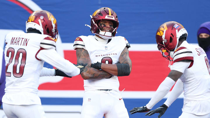 Dec 14, 2025; East Rutherford, New Jersey, USA; Washington Commanders cornerback Mike Sainristil (0) celebrates an interception with teammates during the second quarter against the New York Giants at MetLife Stadium. Mandatory Credit: Vincent Carchietta-Imagn Images Dec 14, 2025; East Rutherford, New Jersey, USA; Washington Commanders cornerback Mike Sainristil (0) celebrates an interception with teammates during the second quarter against the New York Giants at MetLife Stadium. Mandatory Credit: Vincent Carchietta-Imagn Images