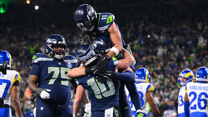 Jan 25, 2026; Seattle, WA, USA; Seattle Seahawks wide receiver Cooper Kupp (10) celebrates with teammates after scoring a touchdown against the Los Angeles Rams during the second half in the 2026 NFC Championship Game at Lumen Field. Mandatory Credit: Steven Bisig-Imagn Images