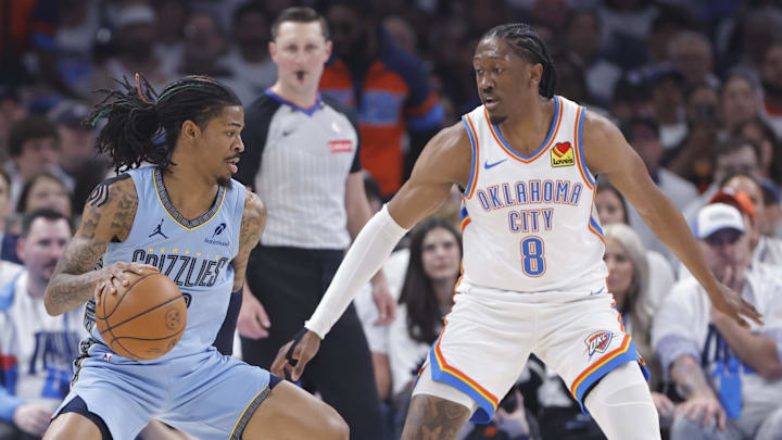 Apr 20, 2025; Oklahoma City, Oklahoma, USA; Memphis Grizzlies guard Ja Morant (12) drives to the basket as Oklahoma City Thunder forward Jalen Williams (8) defends during the first quarter at Paycom Center. Mandatory Credit: Alonzo Adams-Imagn Images